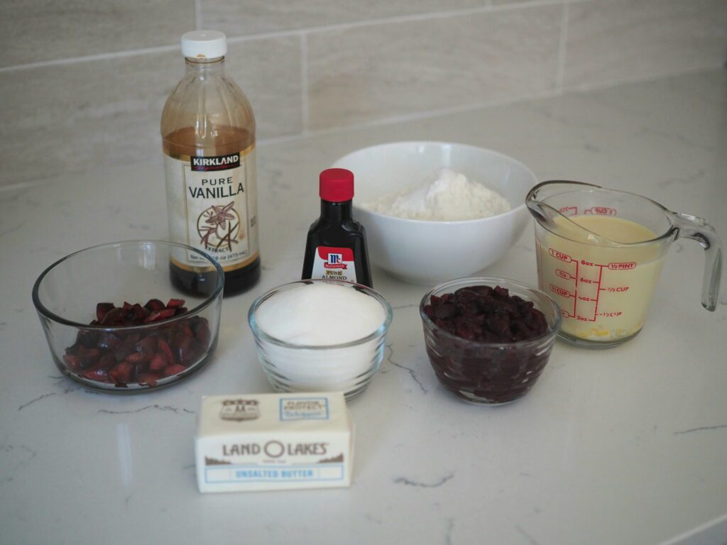 Cherry almond cupcake ingredients on a quartz counter.