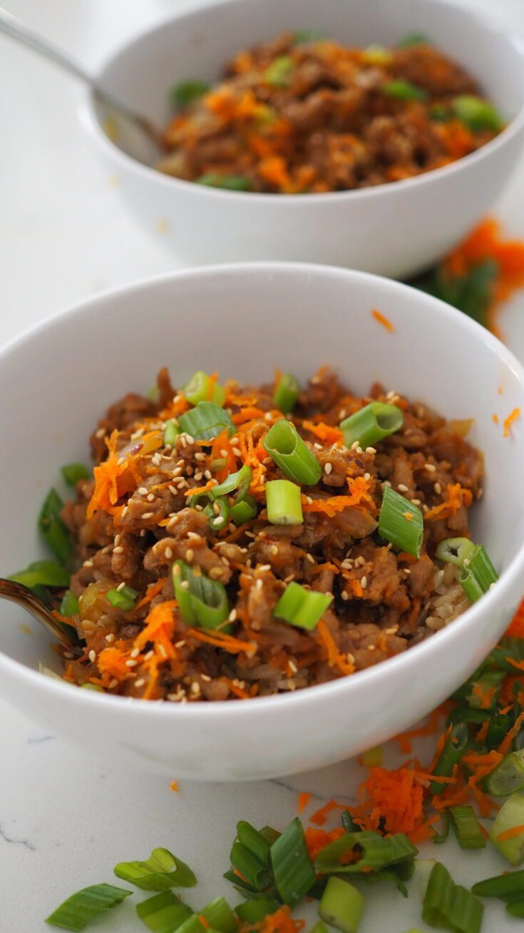 Two bowls of hoisin turkey and brown rice bowls