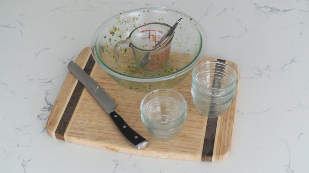 A few small bowls, a mixing bowl, a measuring cup, a knife, and cutting board are the only dishes I used for this garlic herb crouton recipe.