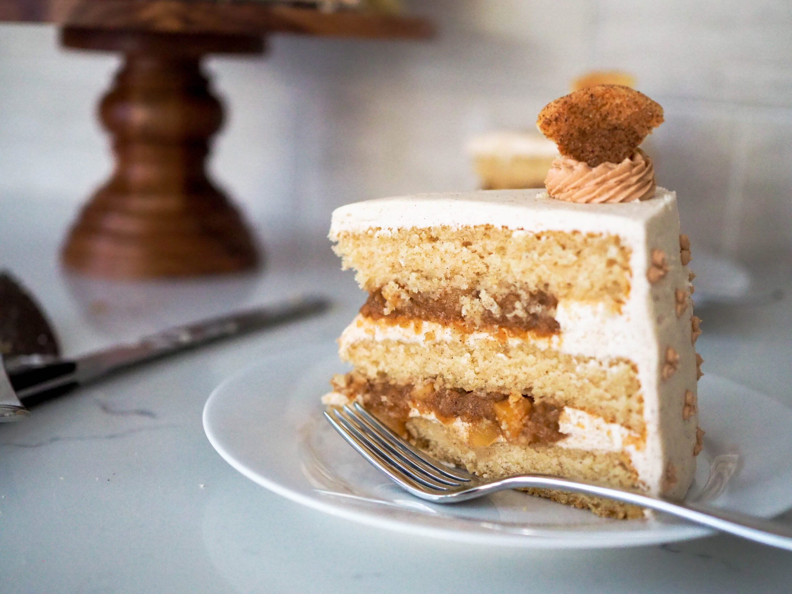 A slice of apple snickerdoodle layer cake.