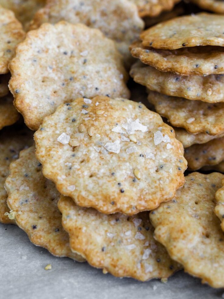 Stacks of sesame and poppy seed crackers.