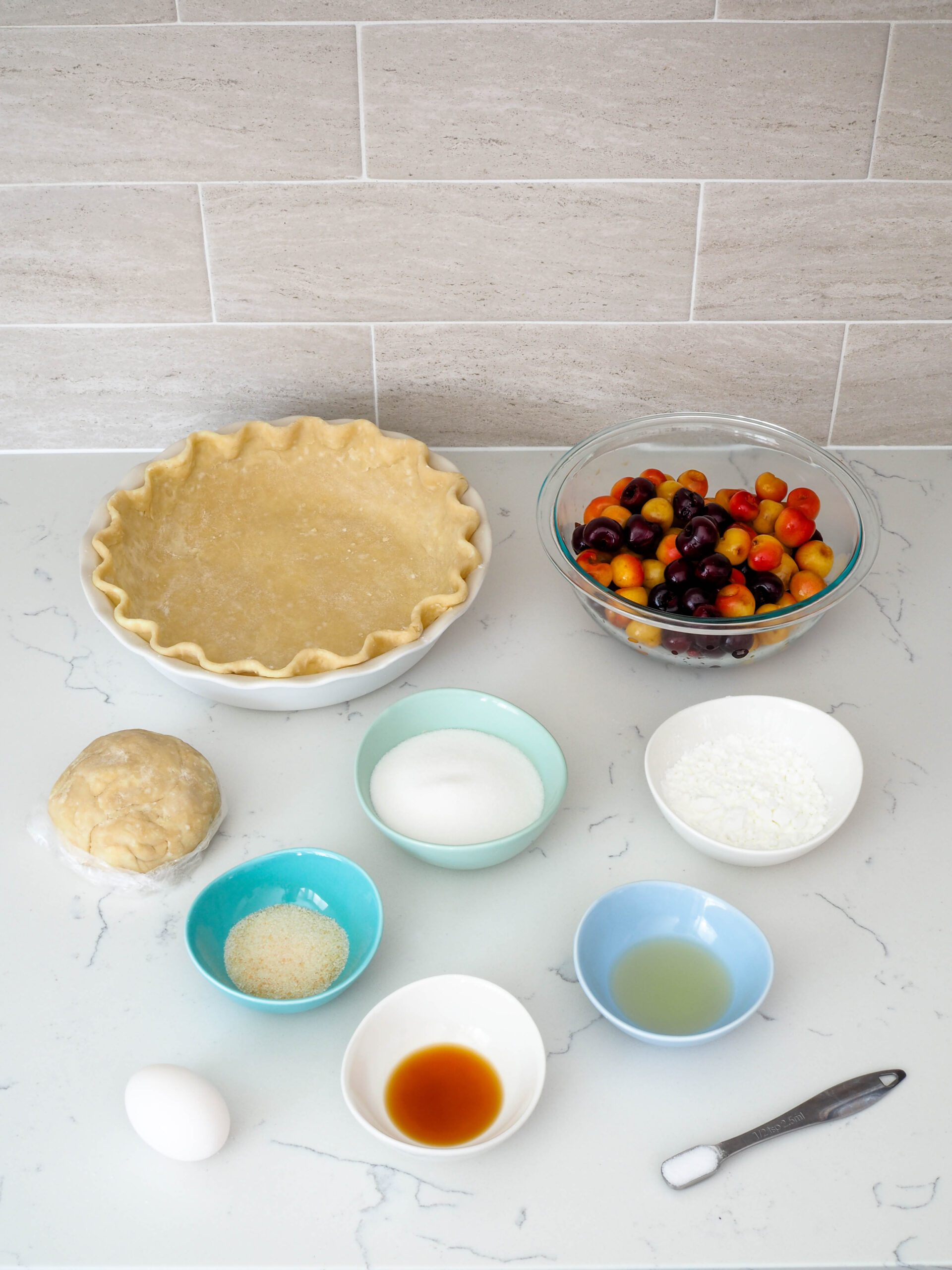 The ingredients for cherry pie with almond extract laid out on a counter.