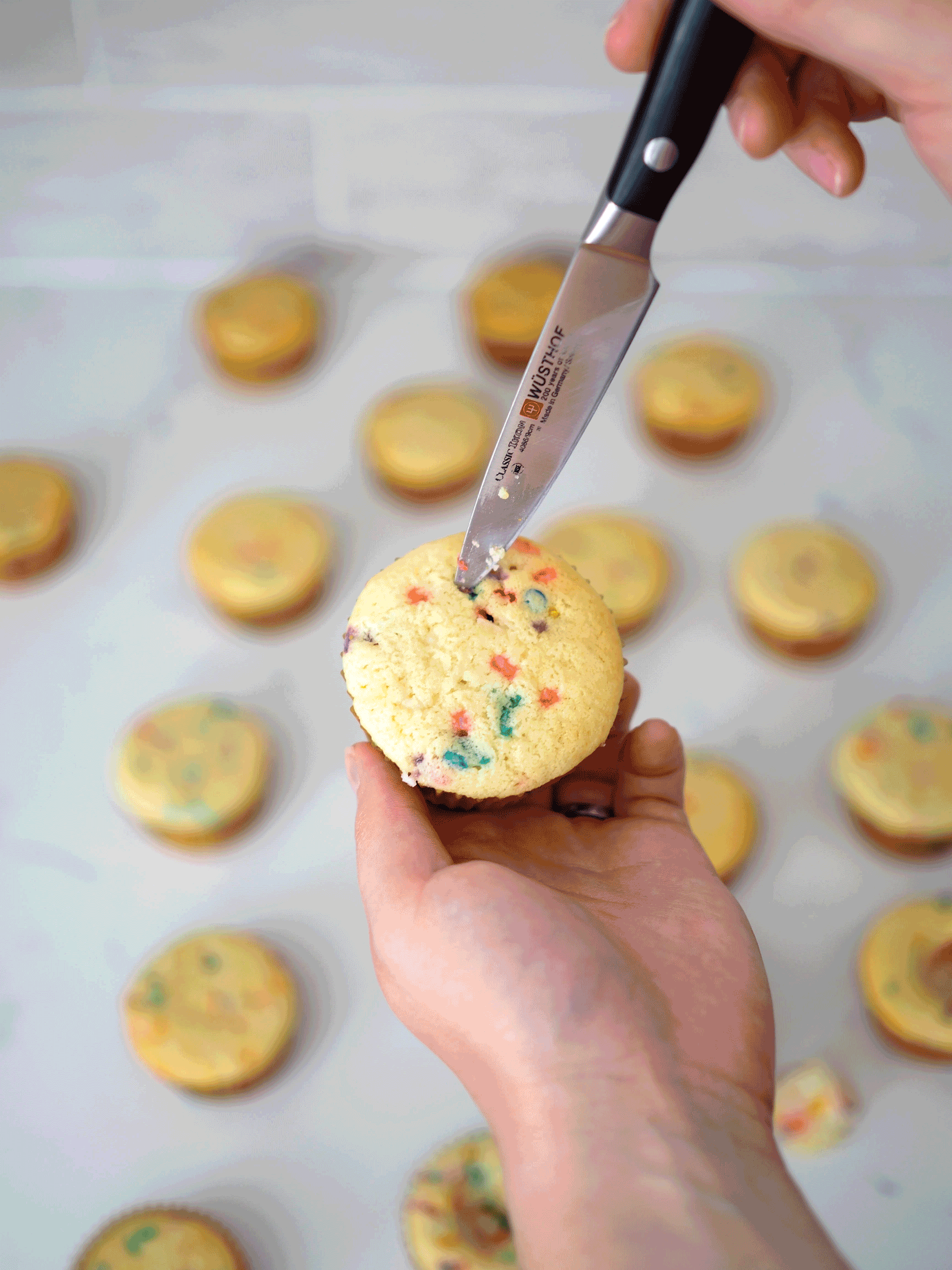 A gif of a cupcake being cored.