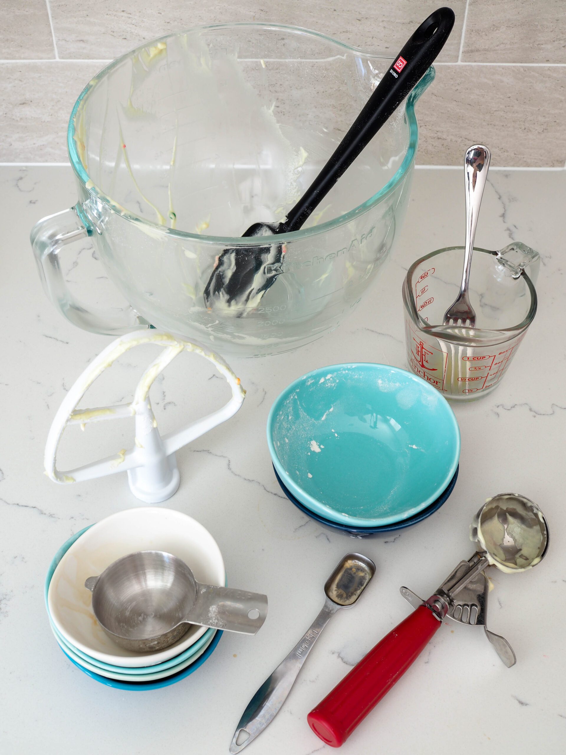 A collection of dishes used to make the confetti cake batter.