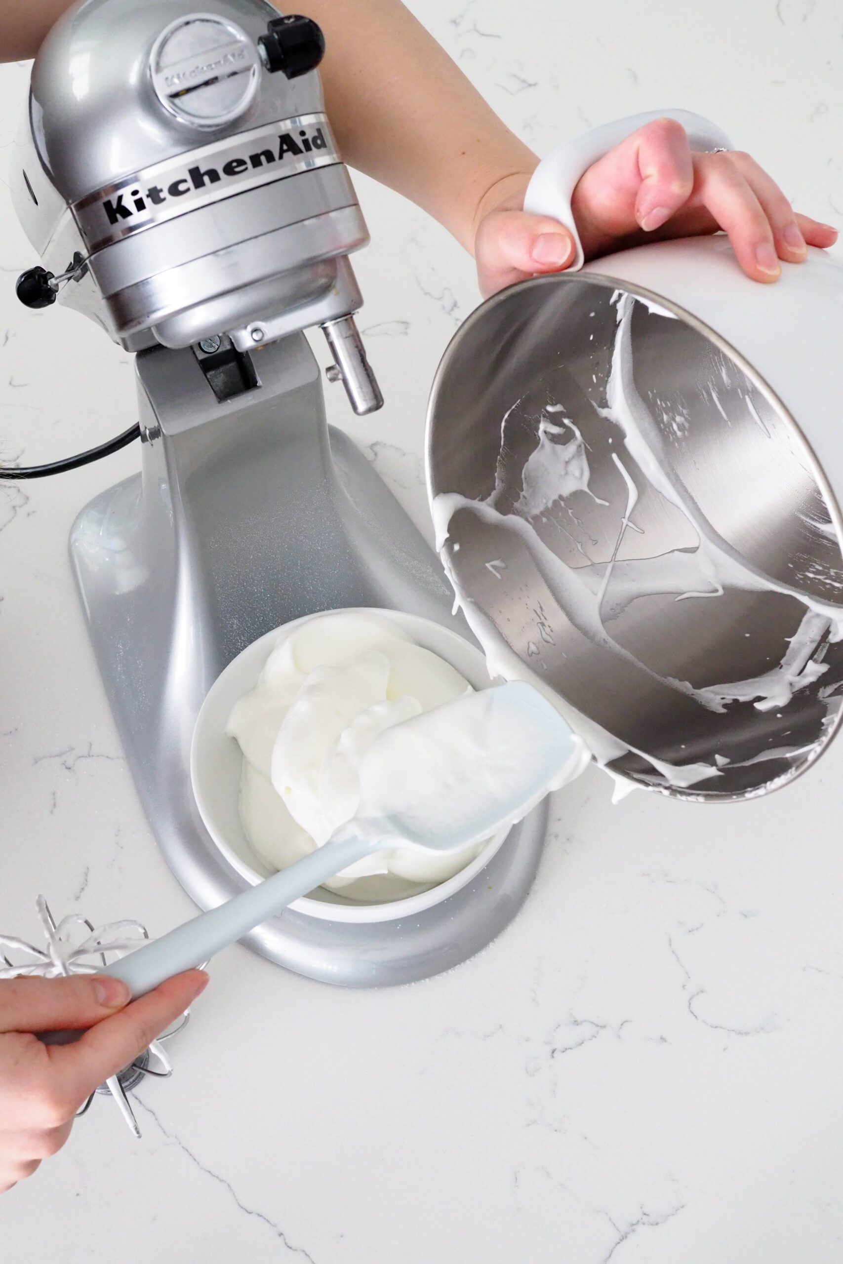 Use a silicone spatula to scrape out the meringue from the bowl.