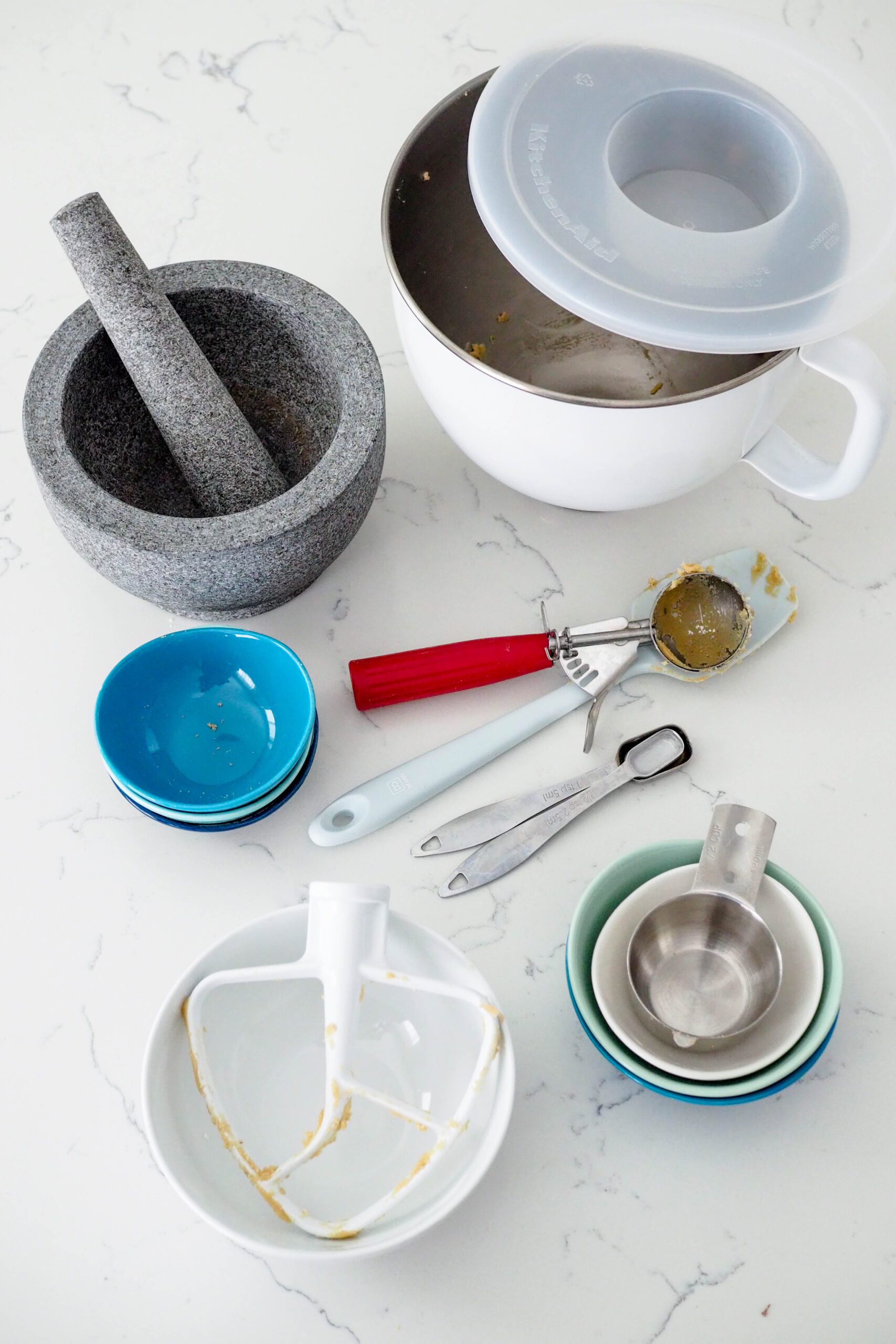 A collection of dishes used to make lavender chocolate chip cookies.