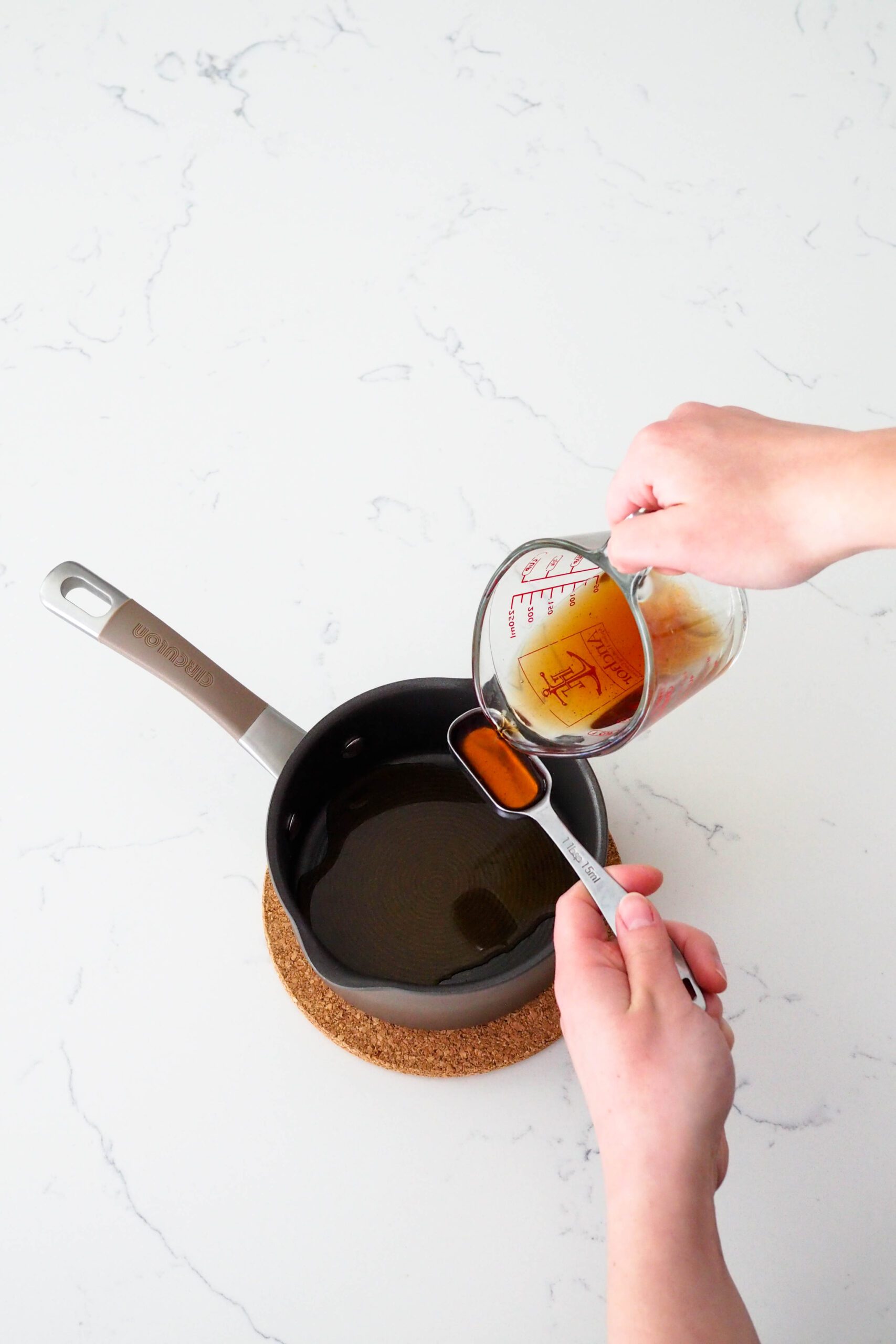 Earl Grey tea is measured into a saucepan.
