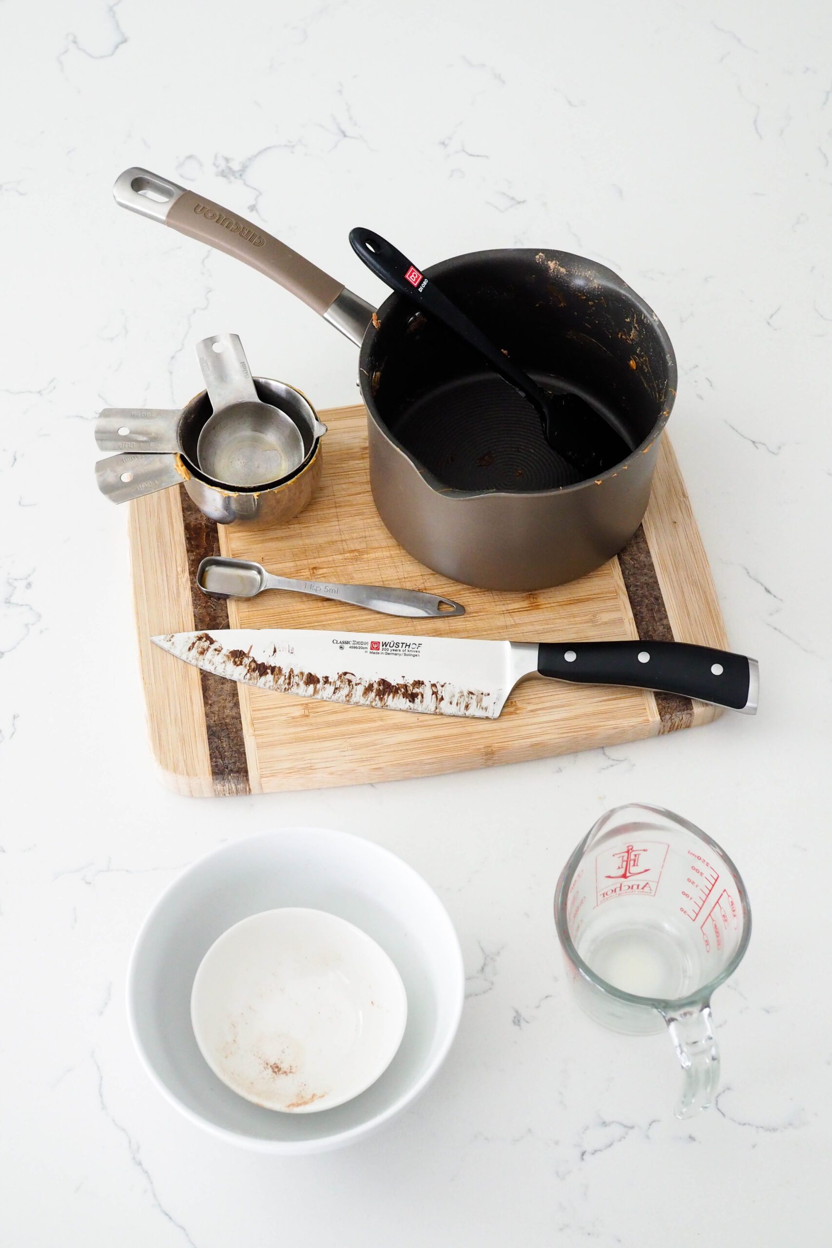 A handful of dishes used to make homemade protein bars.