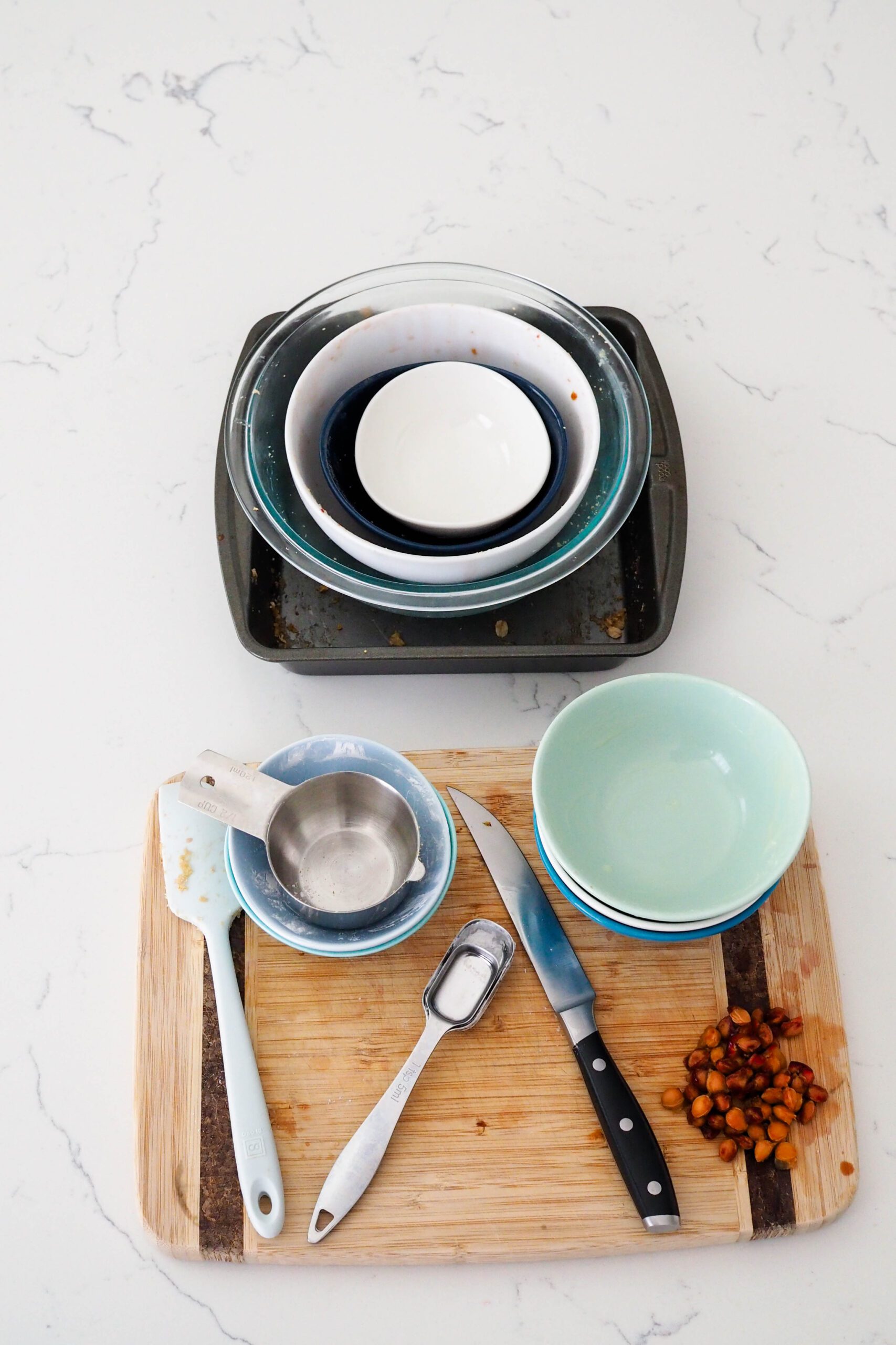 Dishes for gluten-free cherry almond crumble on a countertop.