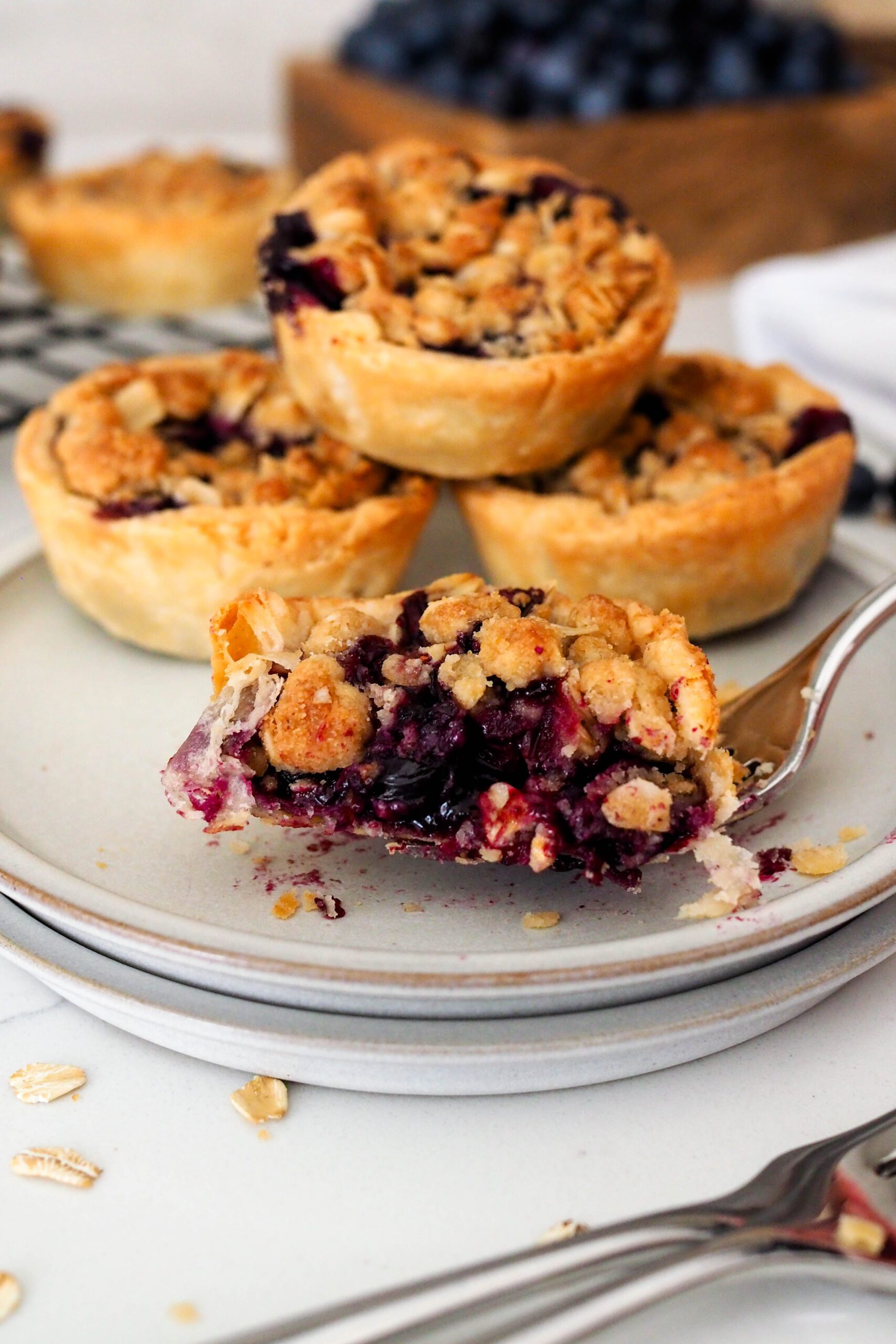 A closeup of the inside of a mini blueberry pie.