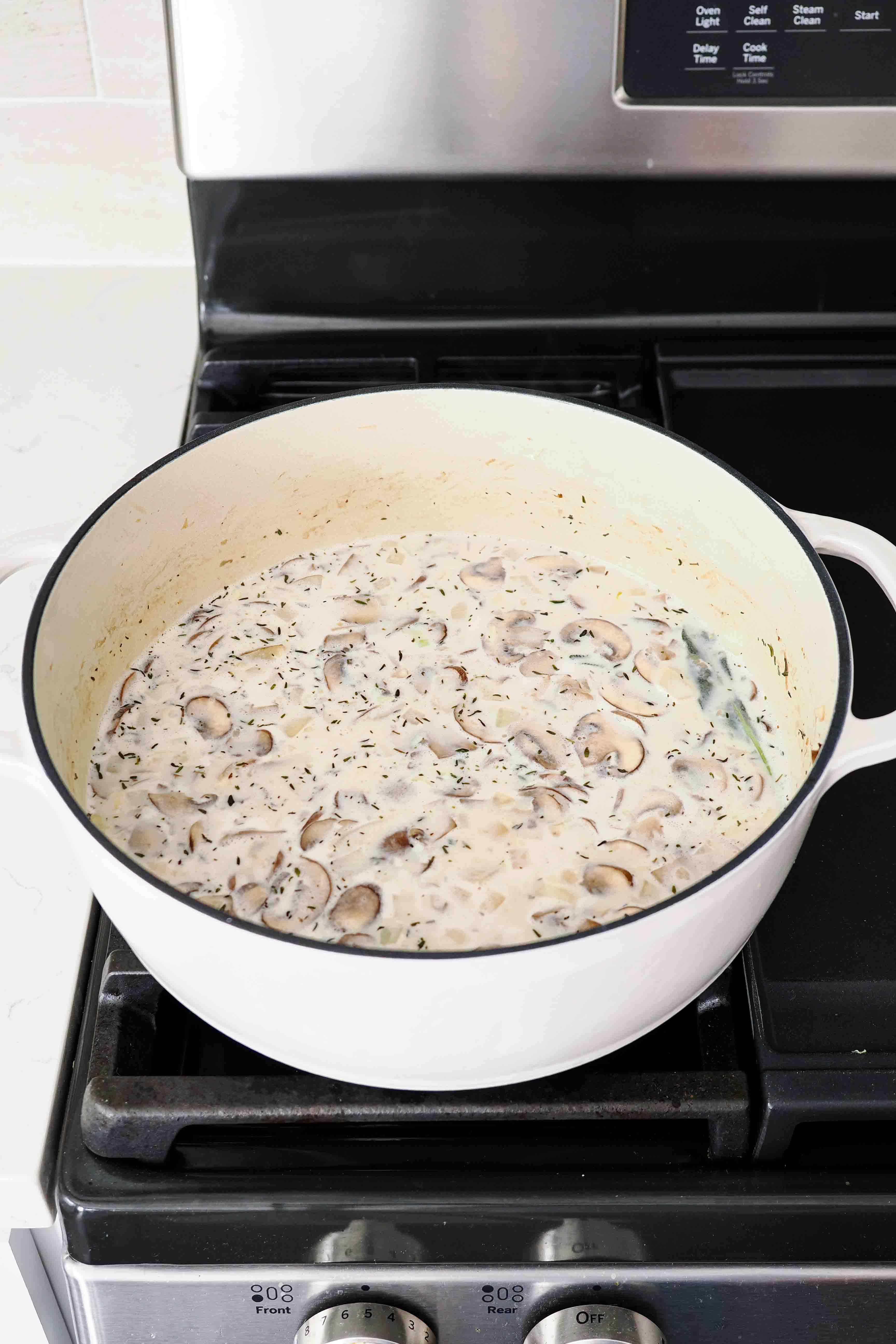 A pot of mushroom potato soup over the stove.