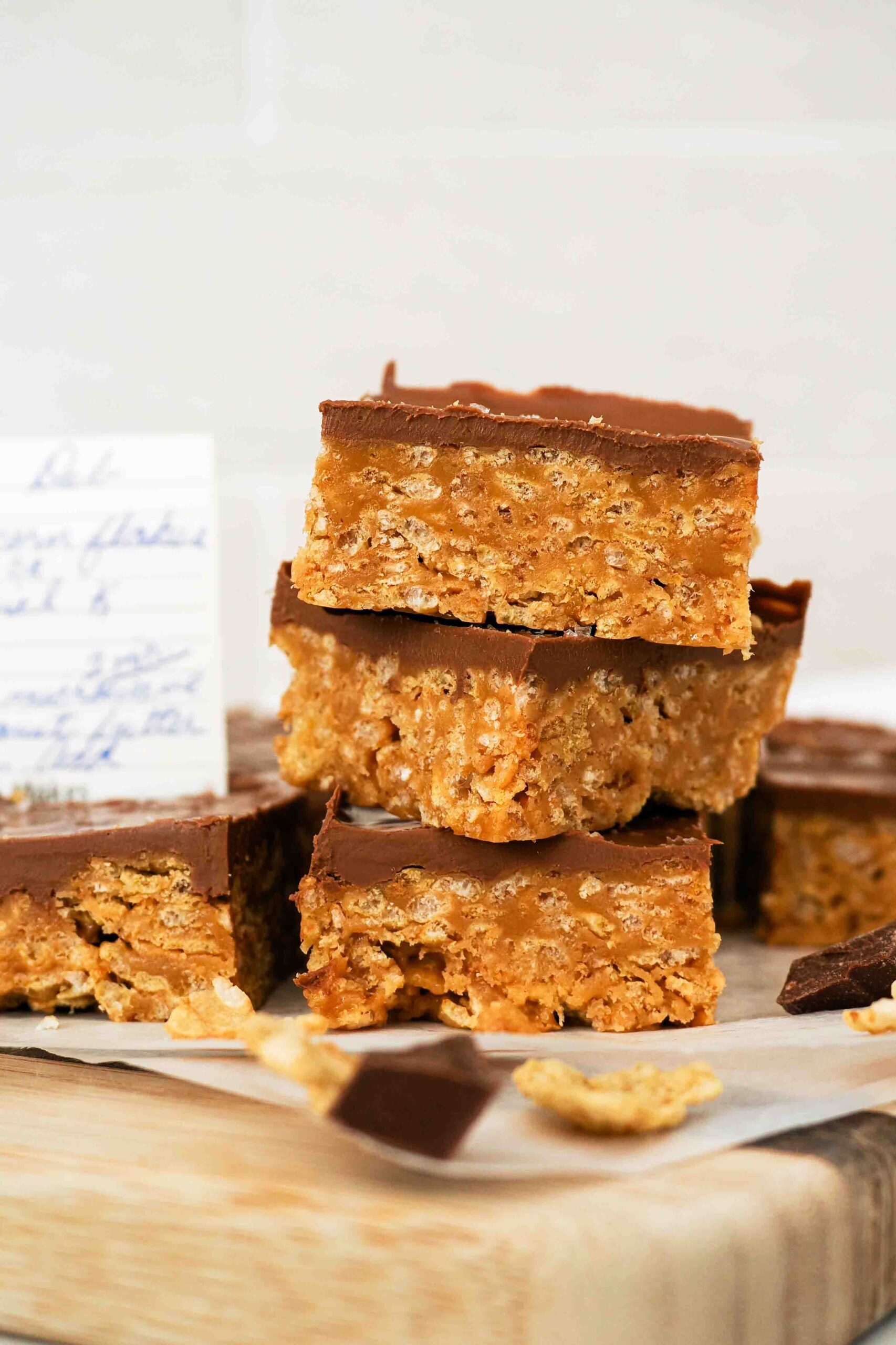 A stack of three Special K bars with a corner of a recipe visible in the background.