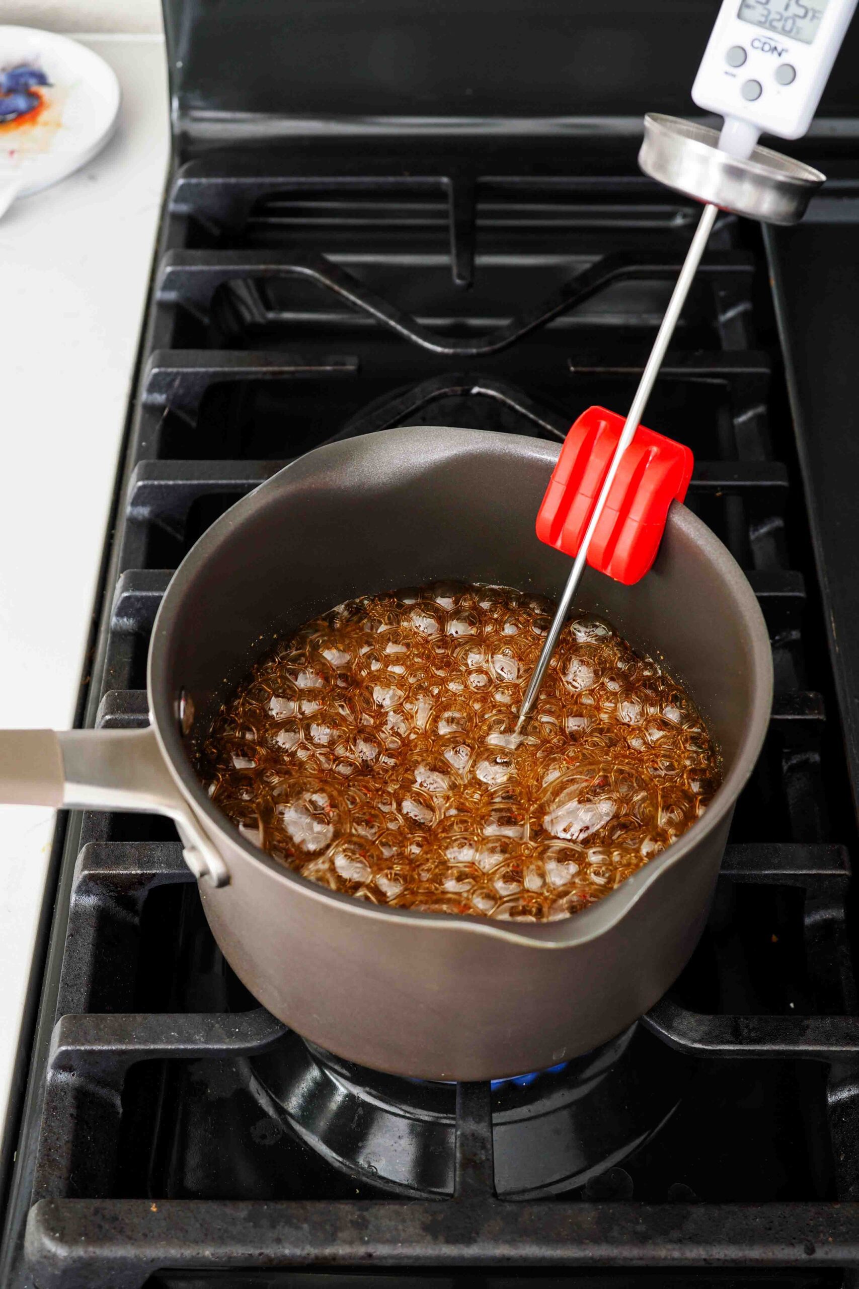 Caramel in a pot over the stove at 315°F.