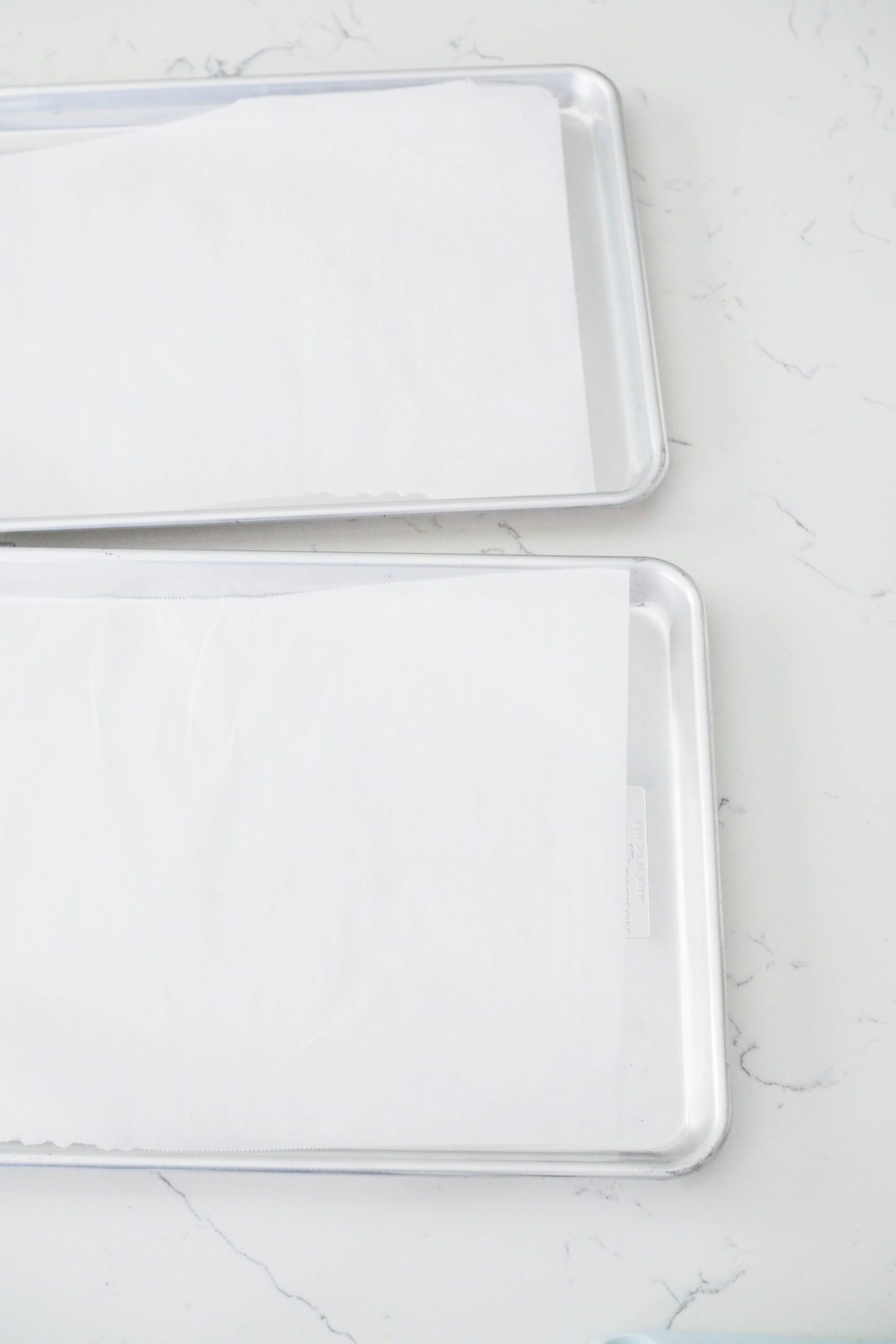 Two parchment paper-lined baking sheets.