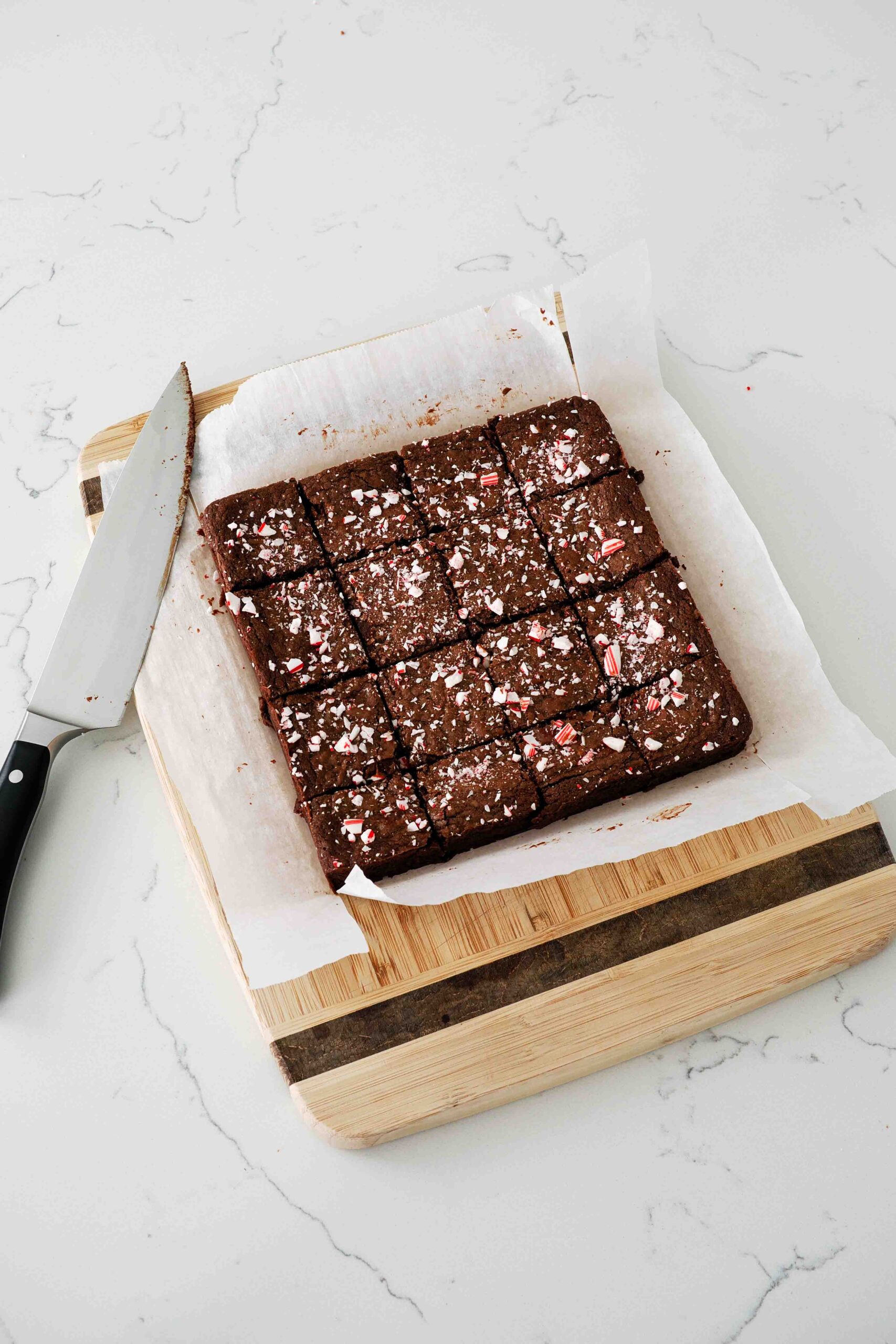 Freshly sliced peppermint brownies on a cutting board.