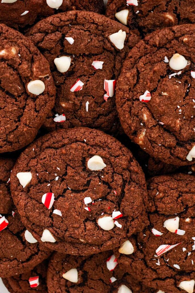An overhead view of a pile of chocolate peppermint cookies.