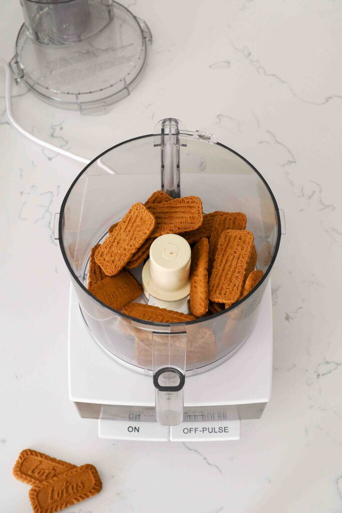 Biscoff biscuits in a food processor bowl.