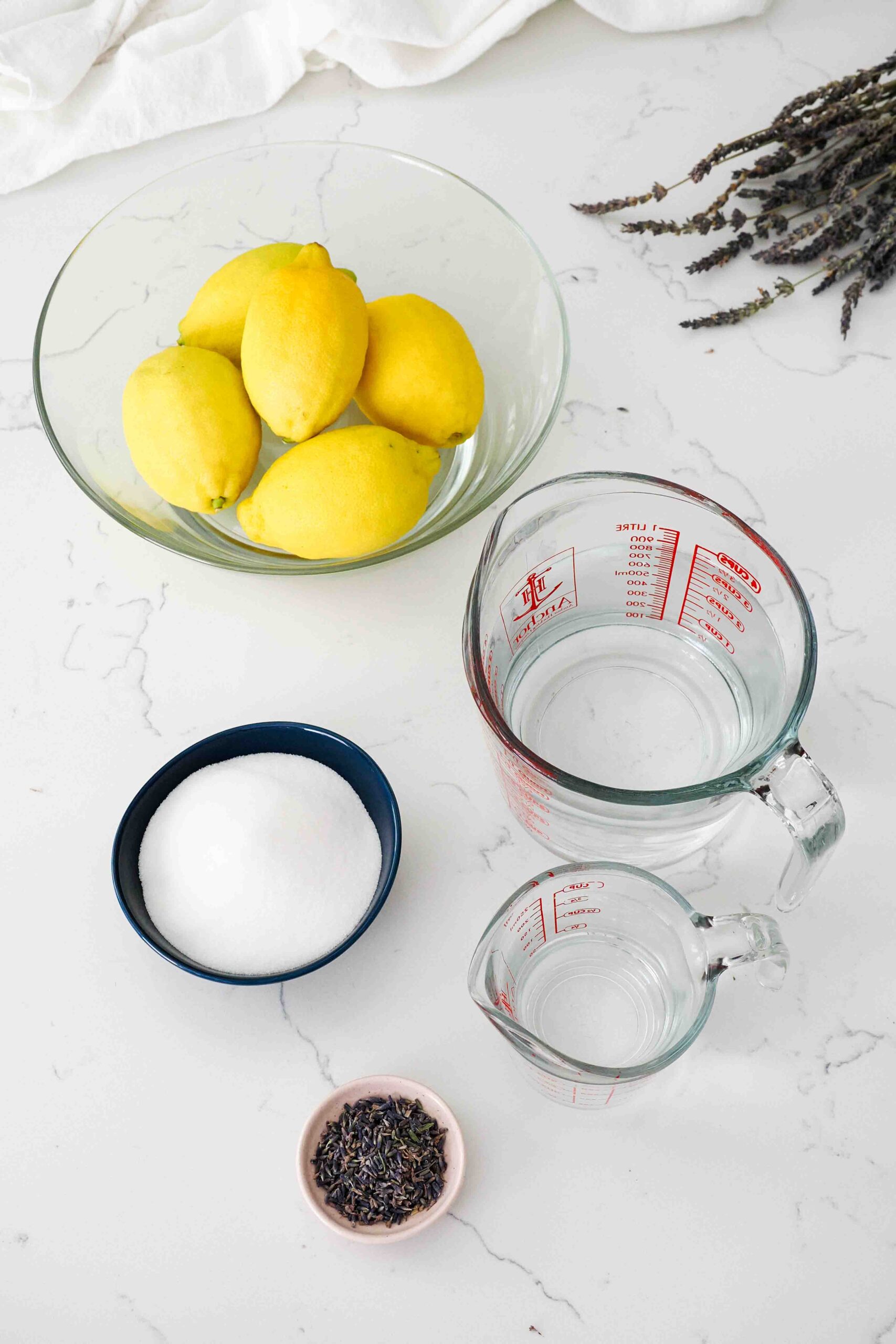 Ingredients for lavender lemonade on a countertop.