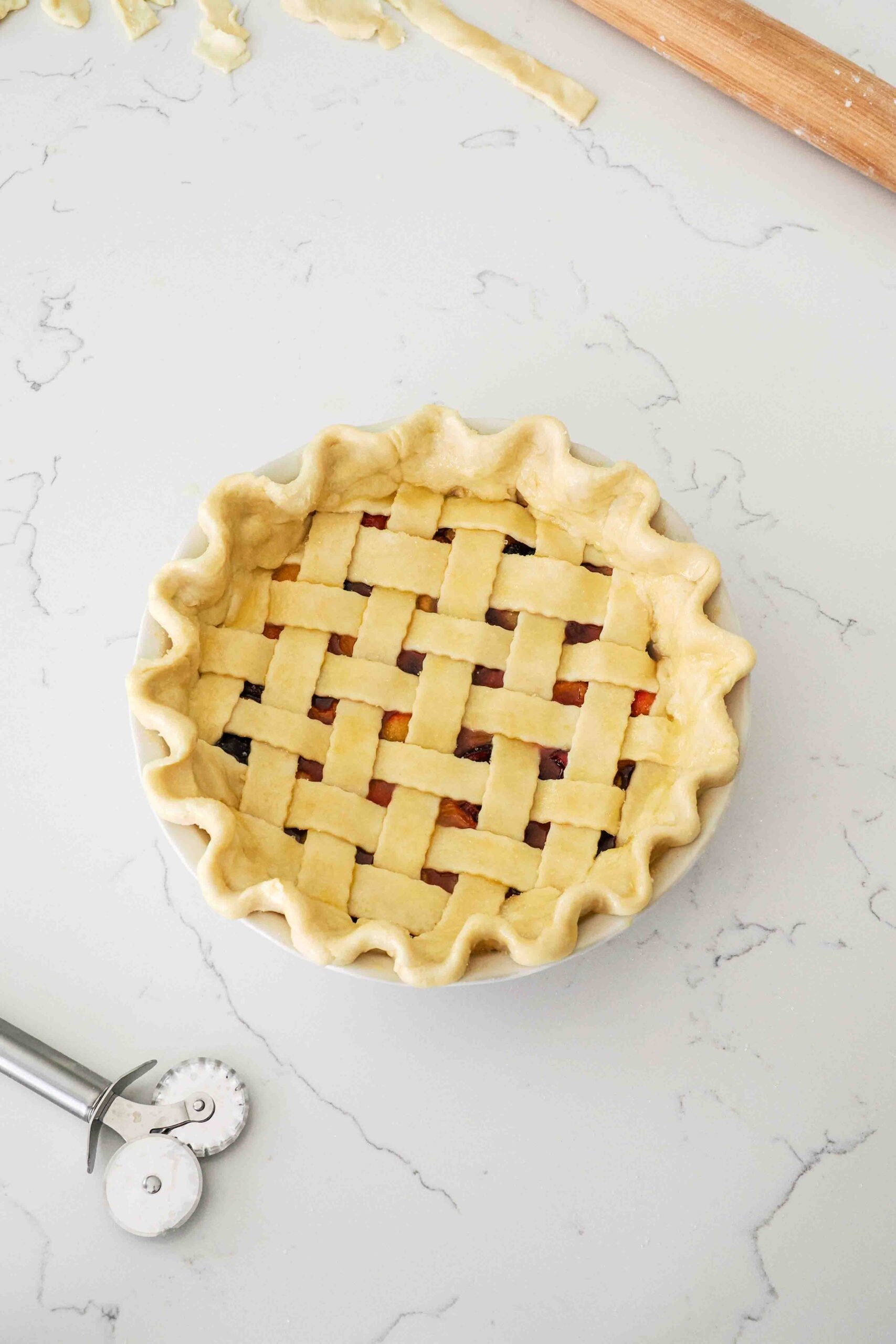 An unbaked cherry pie ready to bake.