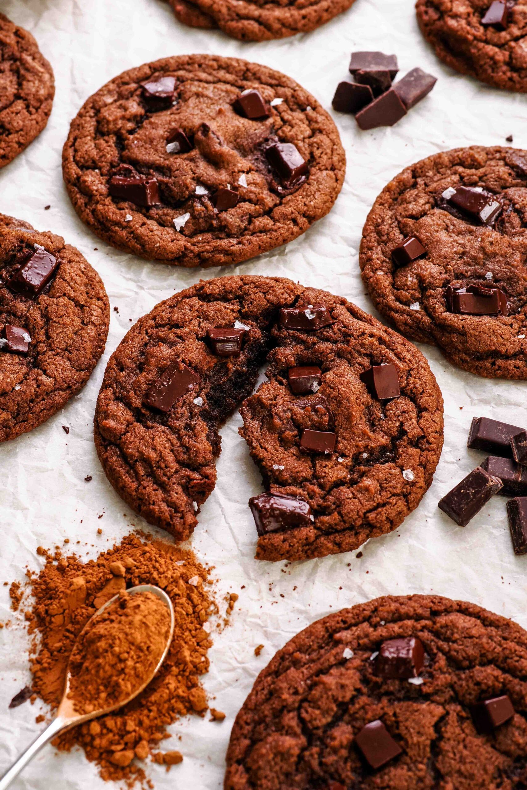 A double chocolate chip cookie broken in half.