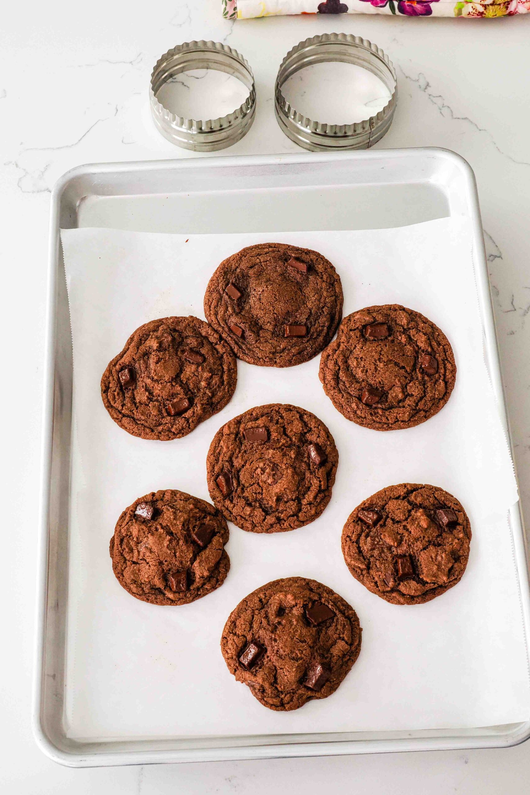 Double chocolate chip cookies before being swirled with a circle cutter.
