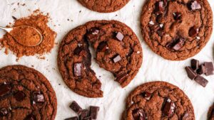 A double chocolate chip cookie split in half.