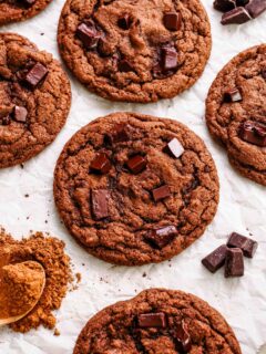 Double chocolate chip cookies on crinkled parchment paper.