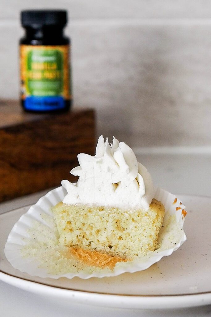 Half of a vanilla bean cupcake.