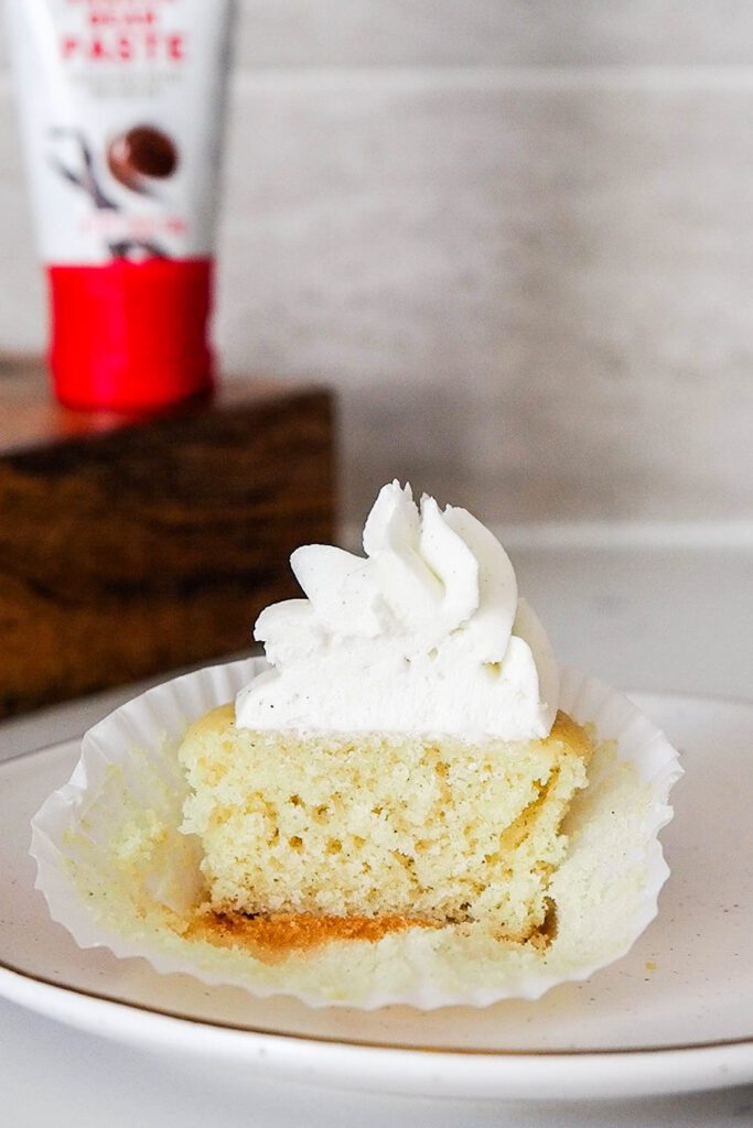 Half of a vanilla bean cupcake.