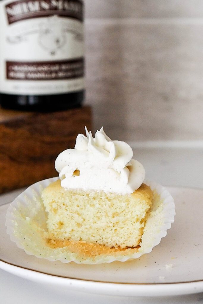 Half of a vanilla bean cupcake.