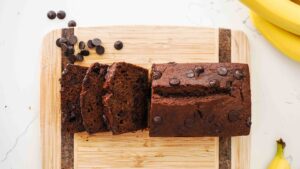 An overhead image of double chocolate banana bread on a cutting board.