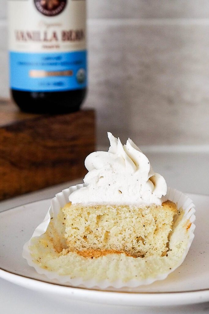 Half of a vanilla bean cupcake.