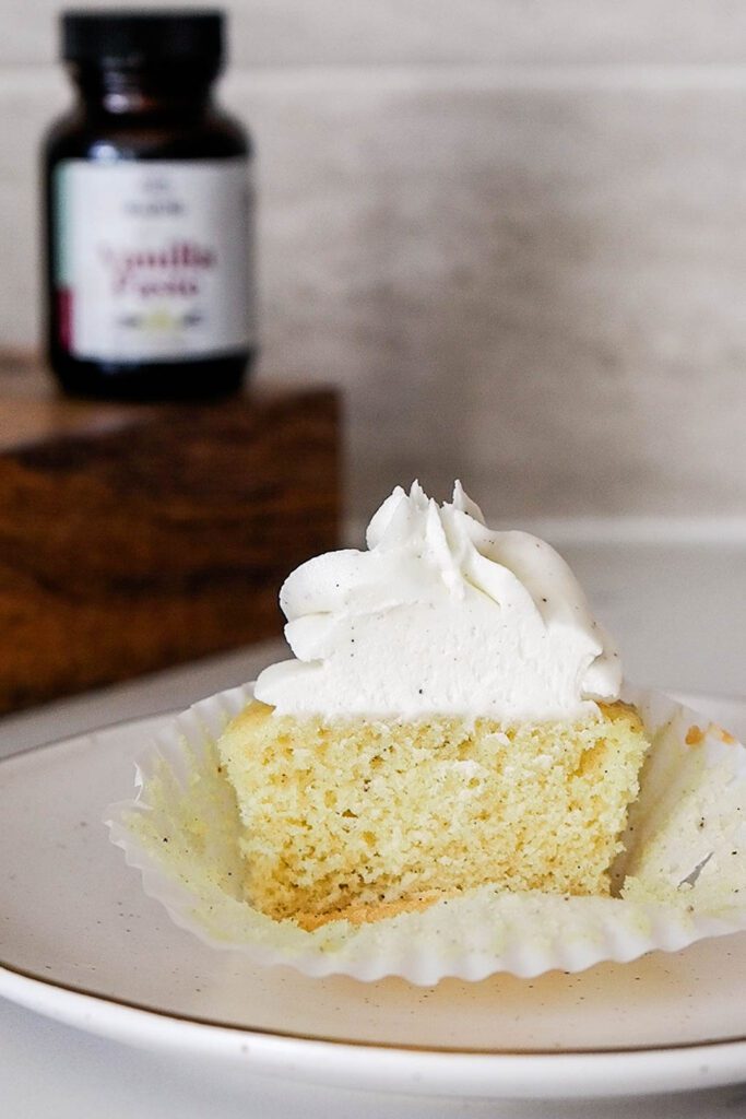 Half of a vanilla bean cupcake.