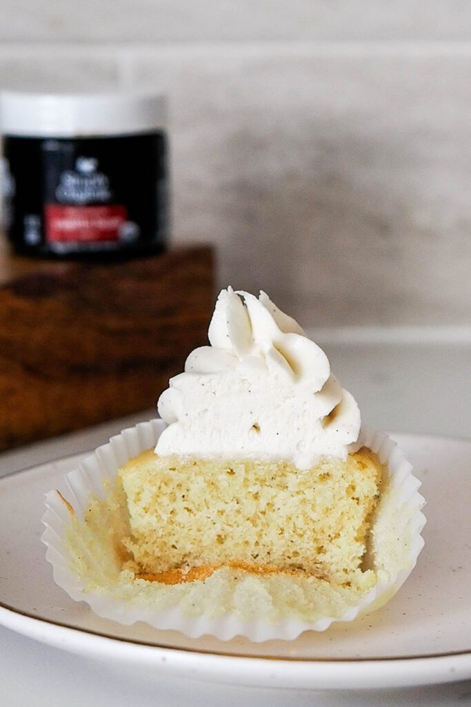 Half of a vanilla bean cupcake.