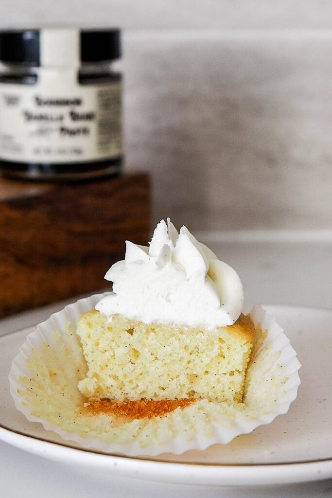 Half of a vanilla bean cupcake.