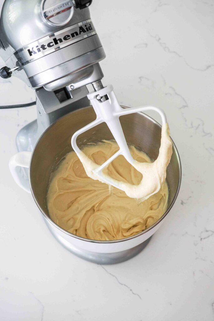 Smooth, fully mixed vanilla bean cupcake batter in a mixing bowl.
