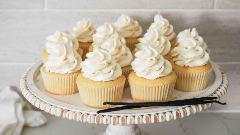 Vanilla bean cupcakes on a cake stand.
