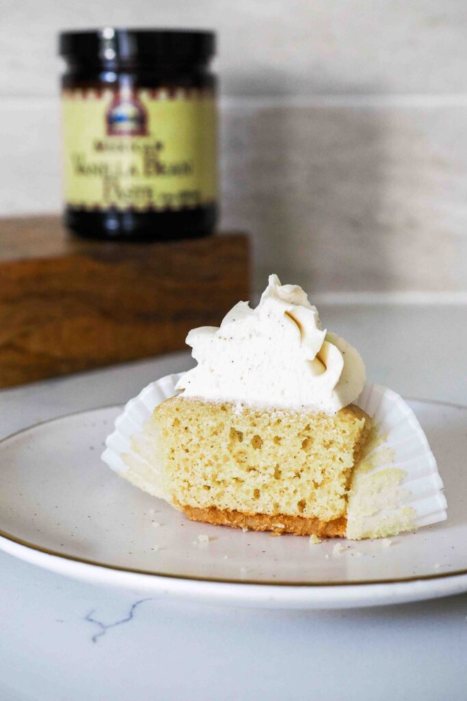 Half of a vanilla bean cupcake.