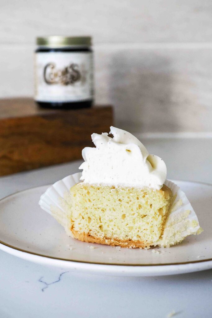 Half of a vanilla bean cupcake.