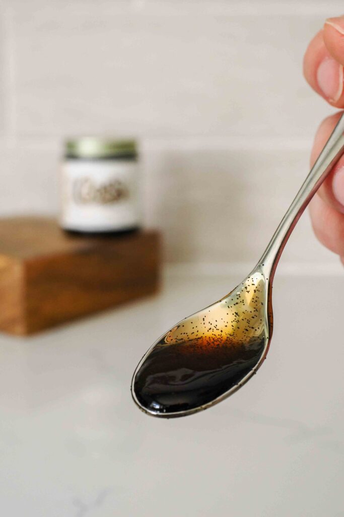 A small spoon with vanilla bean paste.