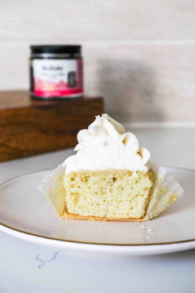 Half of a vanilla bean cupcake.