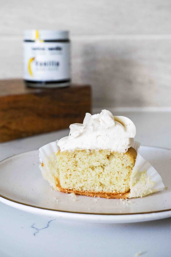 Half of a vanilla bean cupcake.