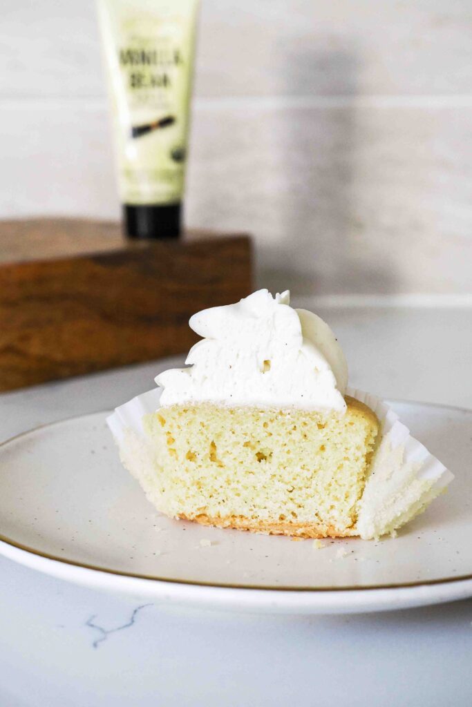 Half of a vanilla bean cupcake.