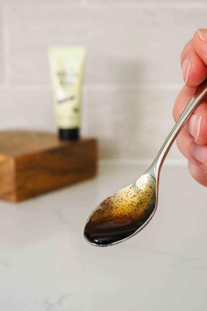 A small spoon with vanilla bean paste.