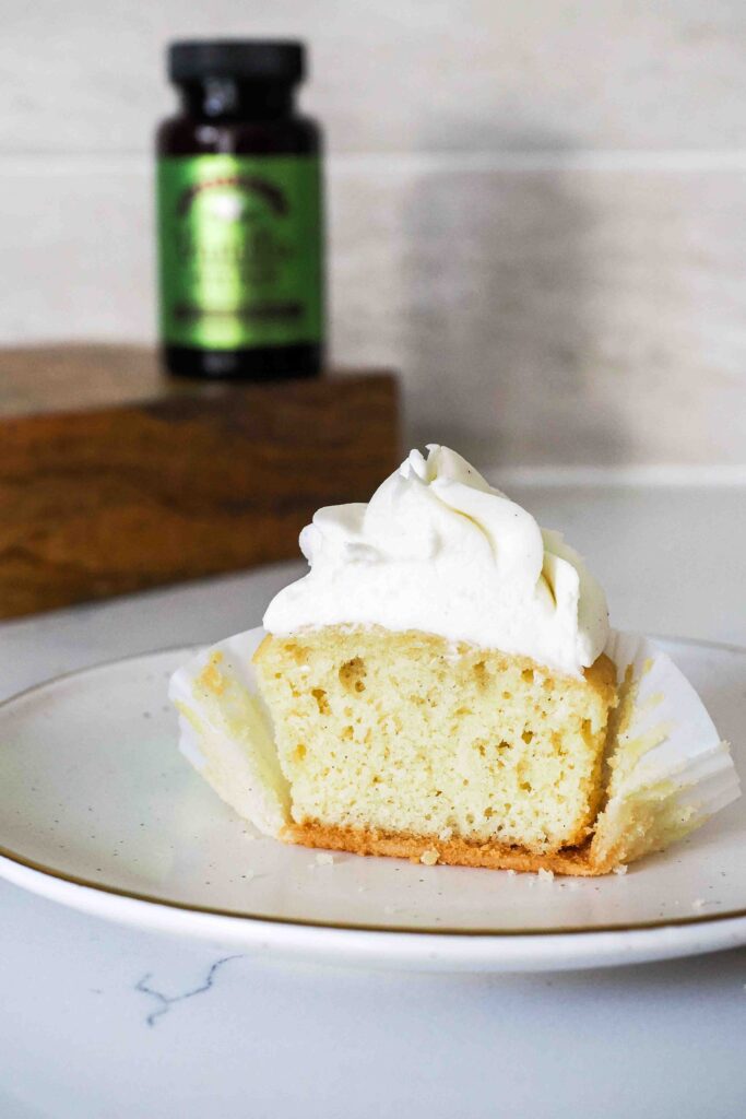 Half of a vanilla bean cupcake.