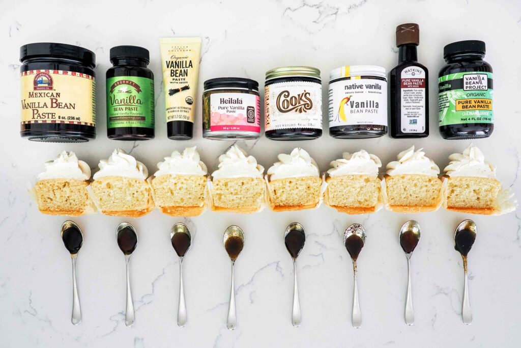 Vanilla bean pastes with half of a cupcake and a spoonful of the paste under each brand.
