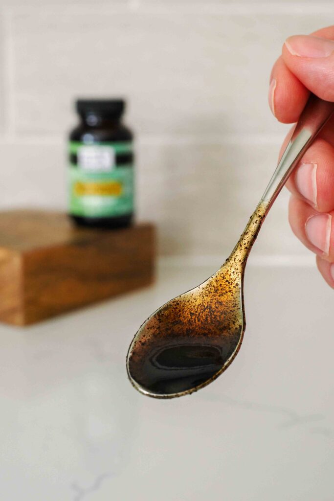A small spoon with vanilla bean paste.