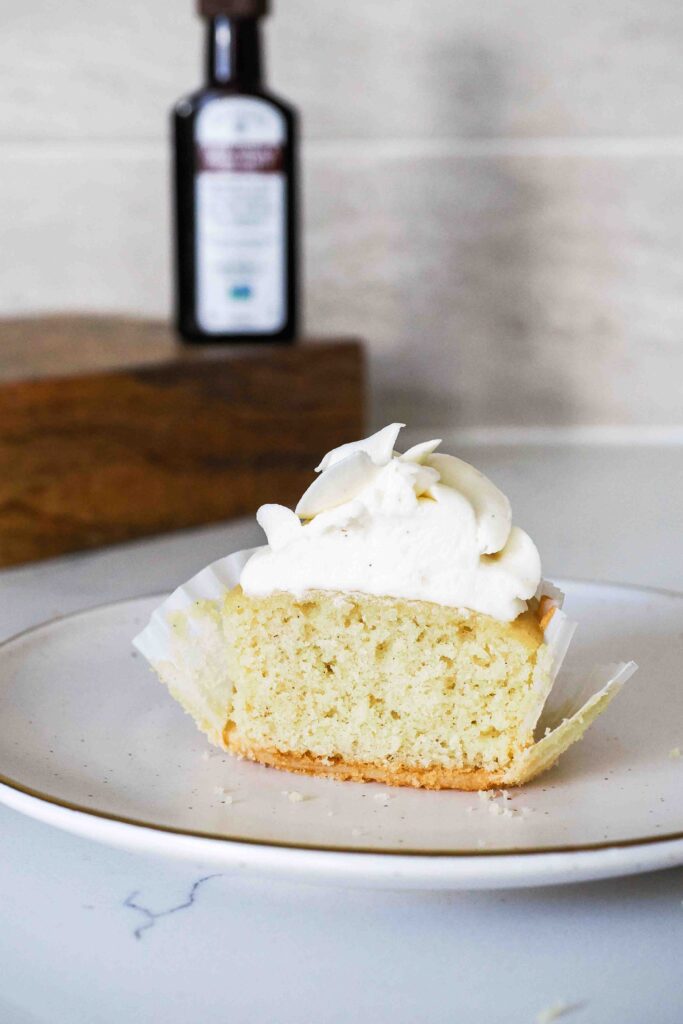 Half of a vanilla bean cupcake.