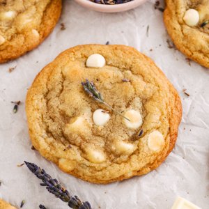 A lavender chocolate chip cookie on parchment.