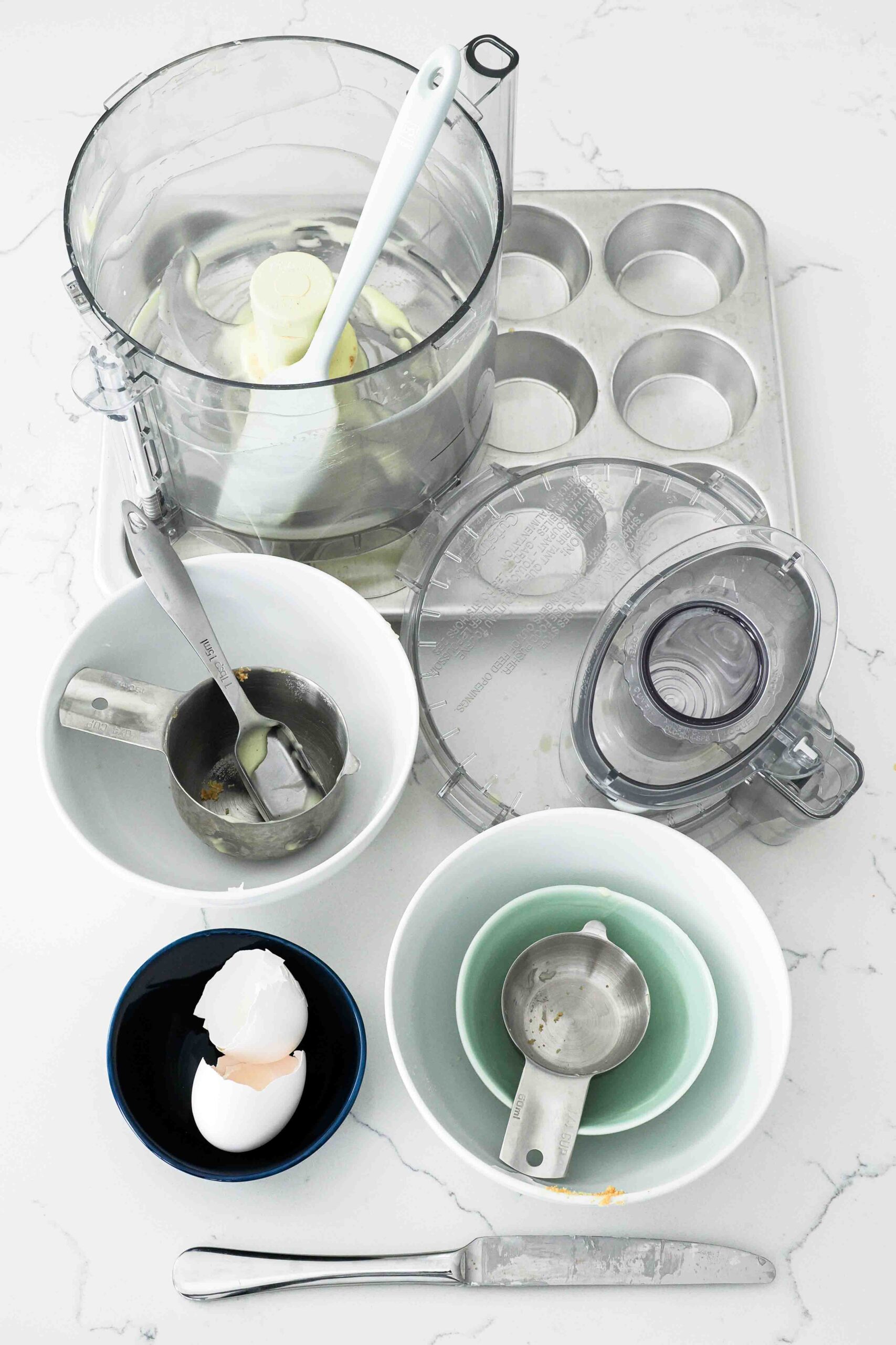 Dishes used to make mini vanilla cheesecakes.